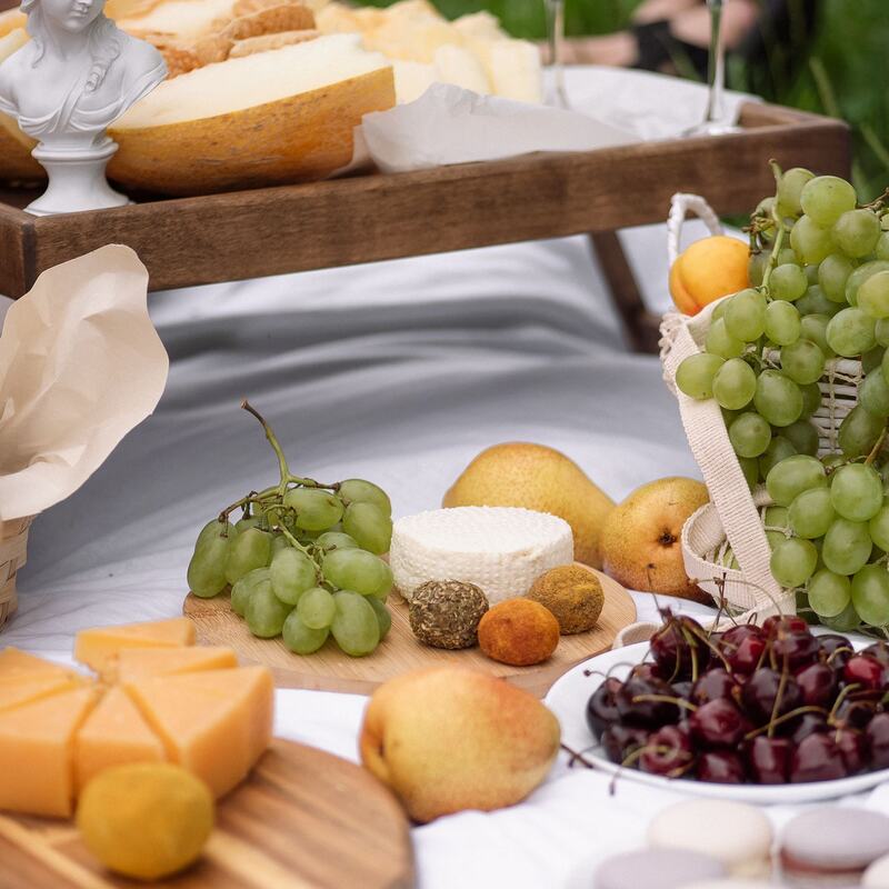 Elegant grazing spread with cheese, grapes and coupe glasses