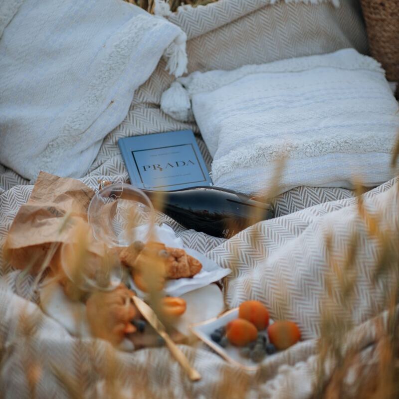 Cushions and blankets nestled in a golden wheat field